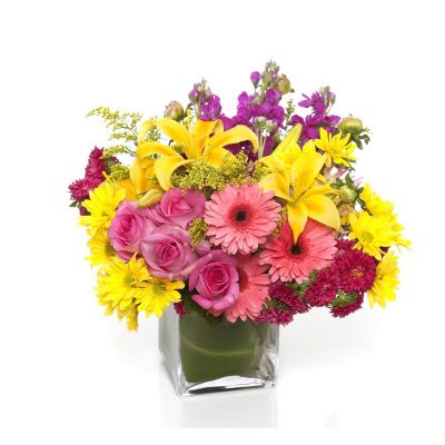 A glass vase of vibrant assorted gerberas