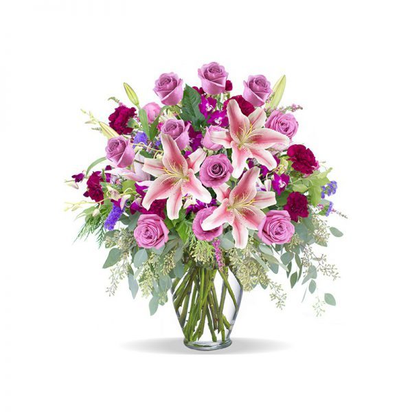 A glass vase of Magnificent Pink, Red Rose and Lily